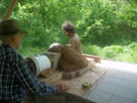 Making the sand igloo.